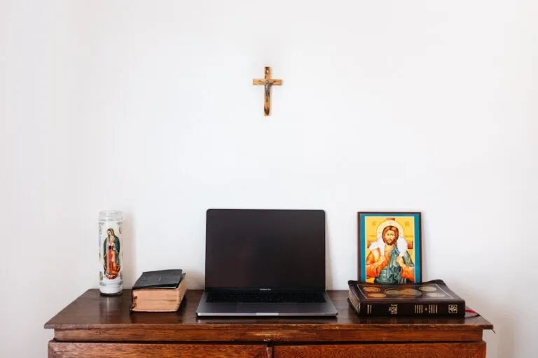 Church staff planning a WordPress website on a laptop in a bright community space